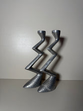 Load image into Gallery viewer, A pair of metal brutalist zig zag candleholders
